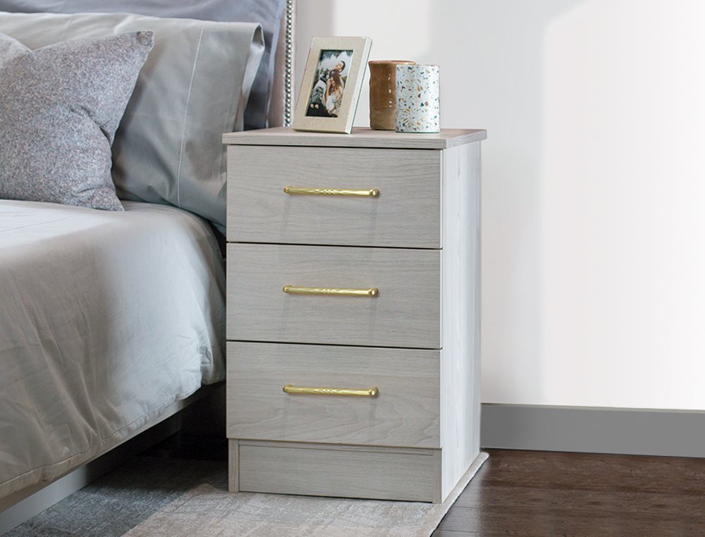 beside chest of drawers with gold handles