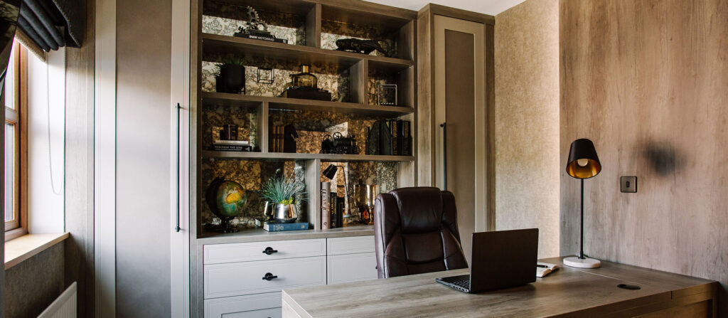 home office with hinge unit and shelving in background