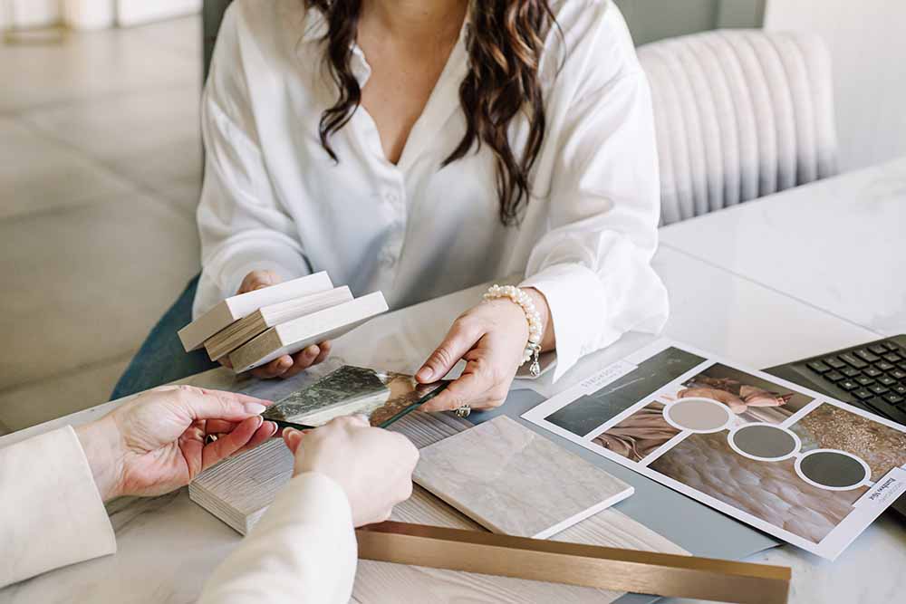 designer showing customer different finishes