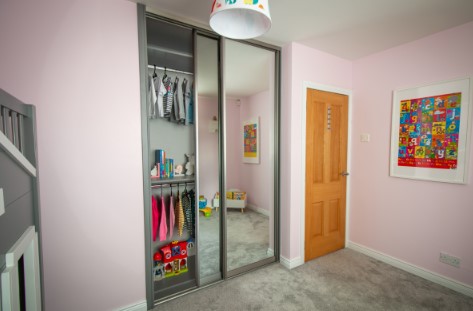 childrens room with sliding mirrored wardrobe