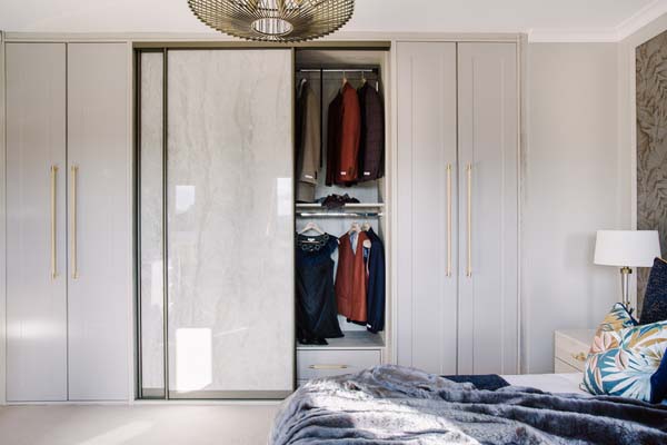 hinge and sliding wardrobe with men's clothes inside