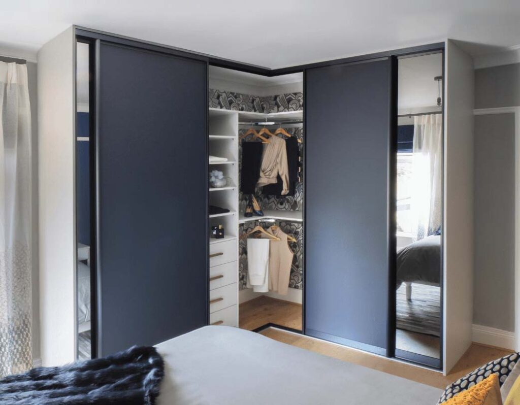 corner sliding wardrobe with clothes inside