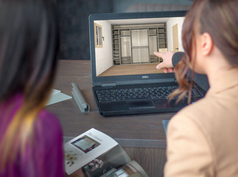 designer showing a customer their wardrobe on cad system