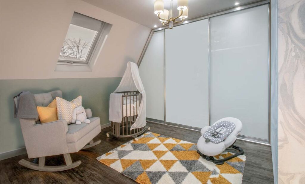 baby room with angled sliding wardrobe
