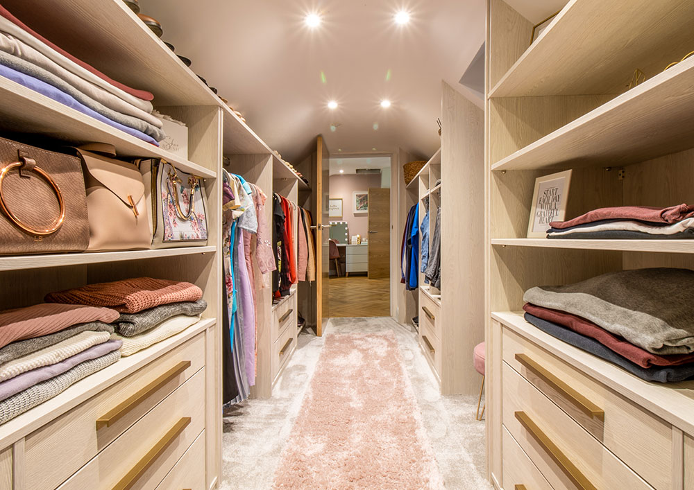 walk in dressing room with shelves either side
