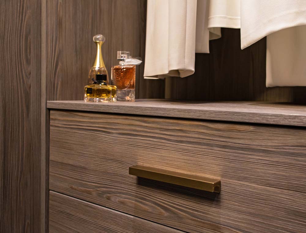 up close of woodgrain hinge drawer