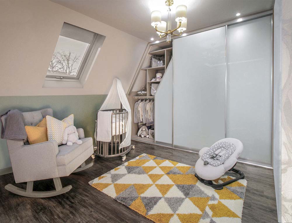 baby room with angled sliding wardrobes