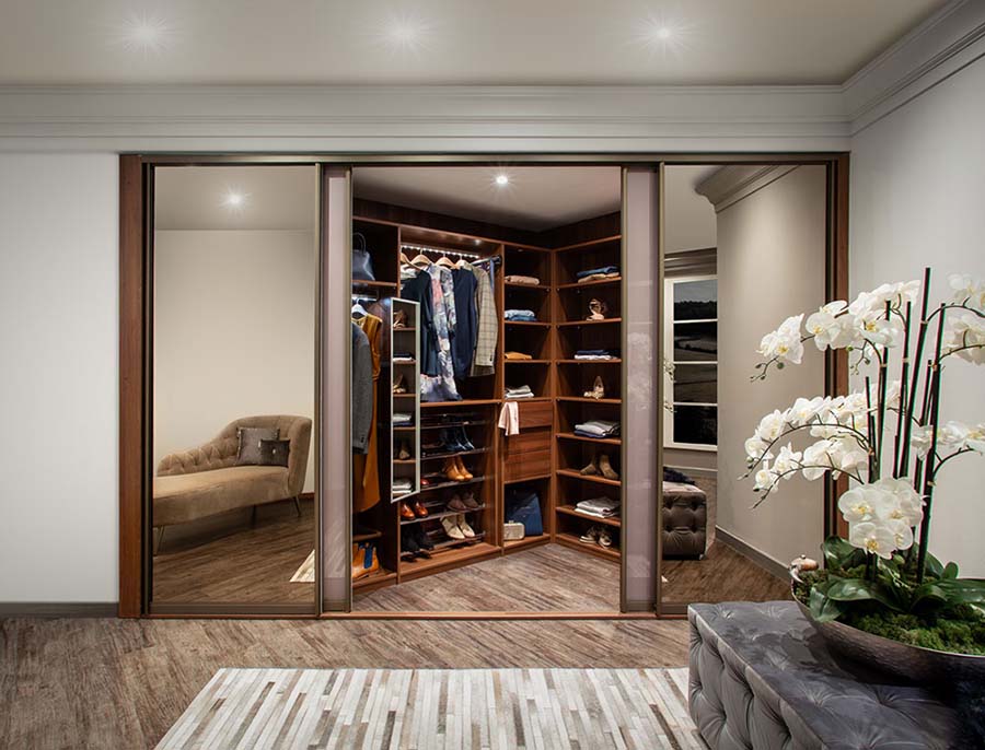 walk in sliding purple and mirrored wardrobe