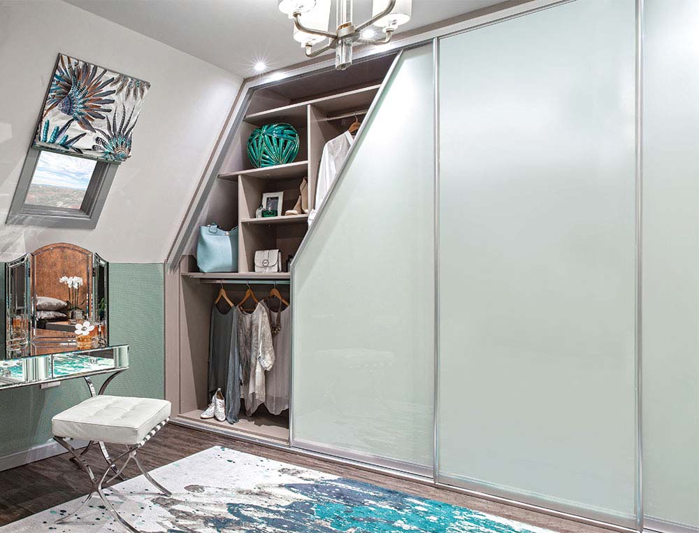 sliding angled wardrobe with clothes inside